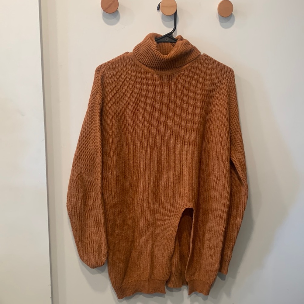 Knit burnt orange turtle neck with slit